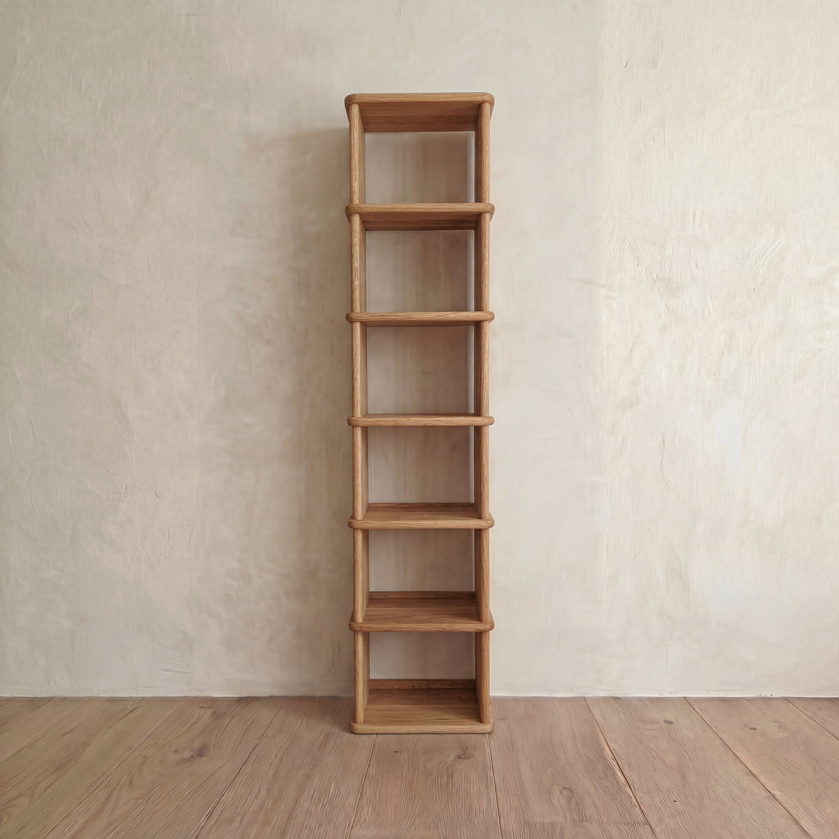 Tall narrow bookcase in white oak
