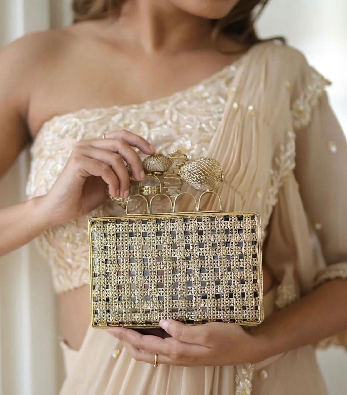 The MERAKI Gold Clutch - Products Added
