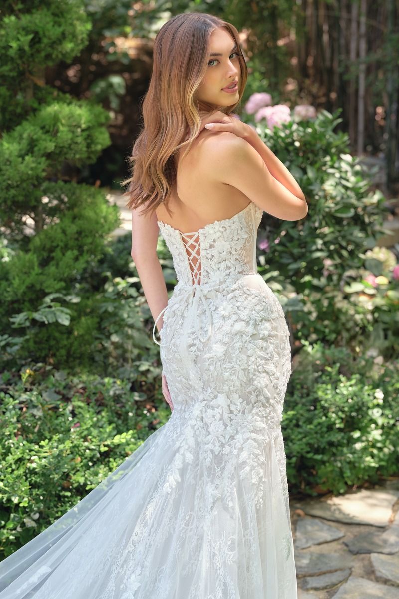 mermaid gown features a strapless lace-up closure for adjustable support