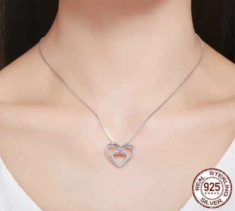 Entwined Hearts: Sterling Silver Infinity Necklace With Double Hearts