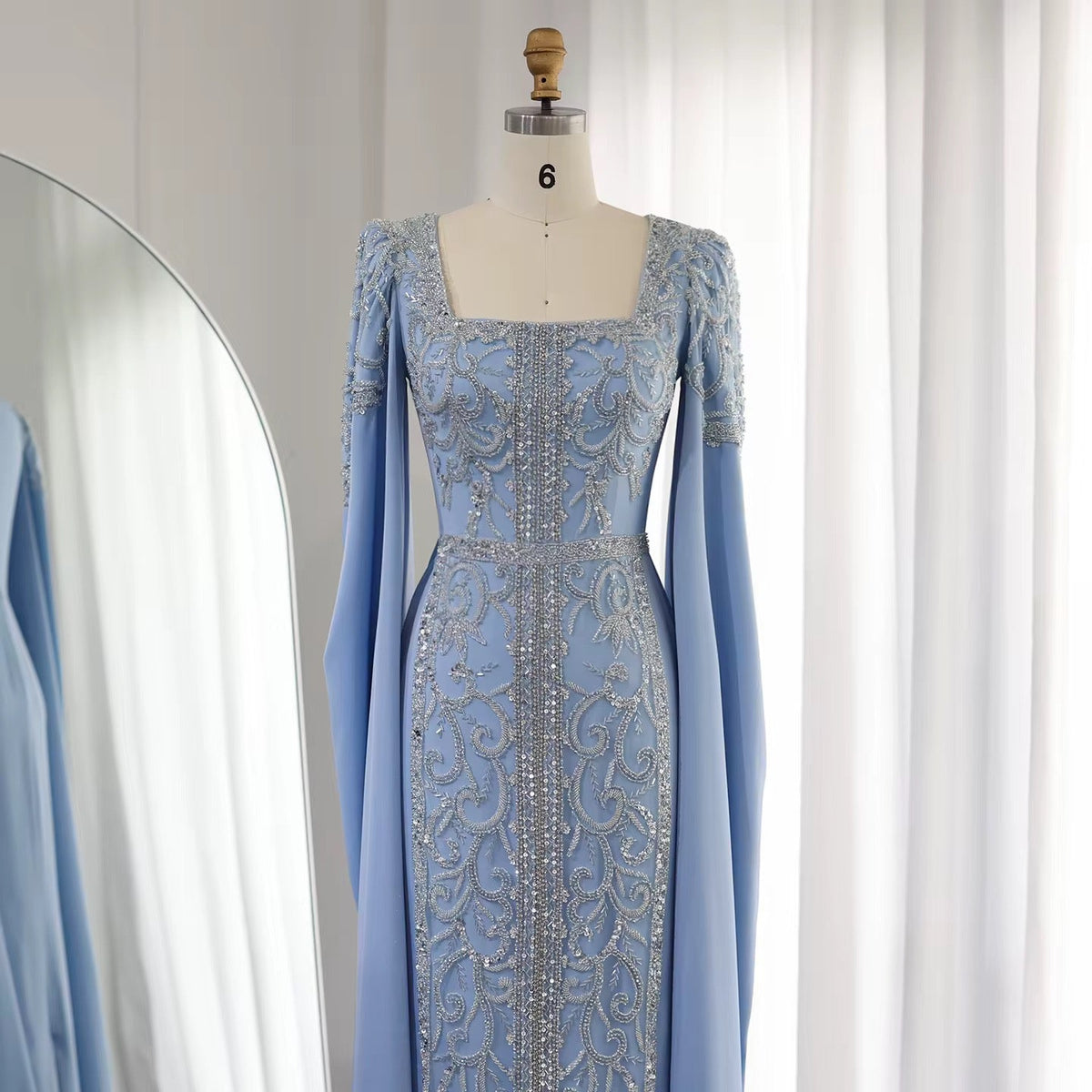 Kaftan style cape sleeves gown