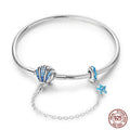 Sterling Silver Seashell Charm Bracelet with Blue CZ Gradient