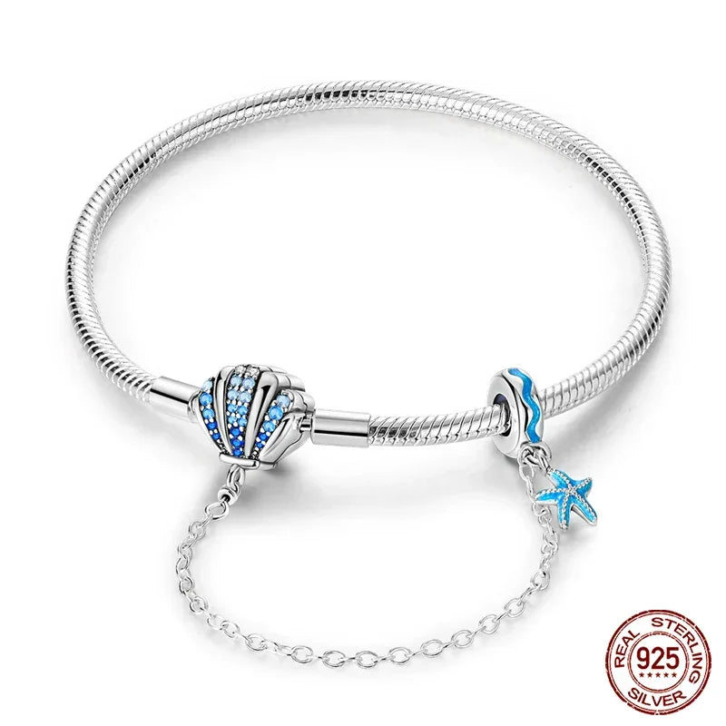 Sterling Silver Seashell Charm Bracelet with Blue CZ Gradient