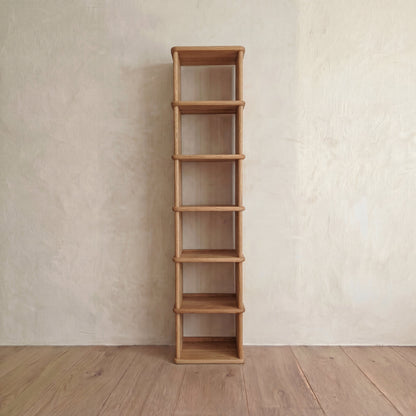 Tall narrow bookcase in white oak