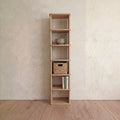 Tall narrow bookcase in white oak