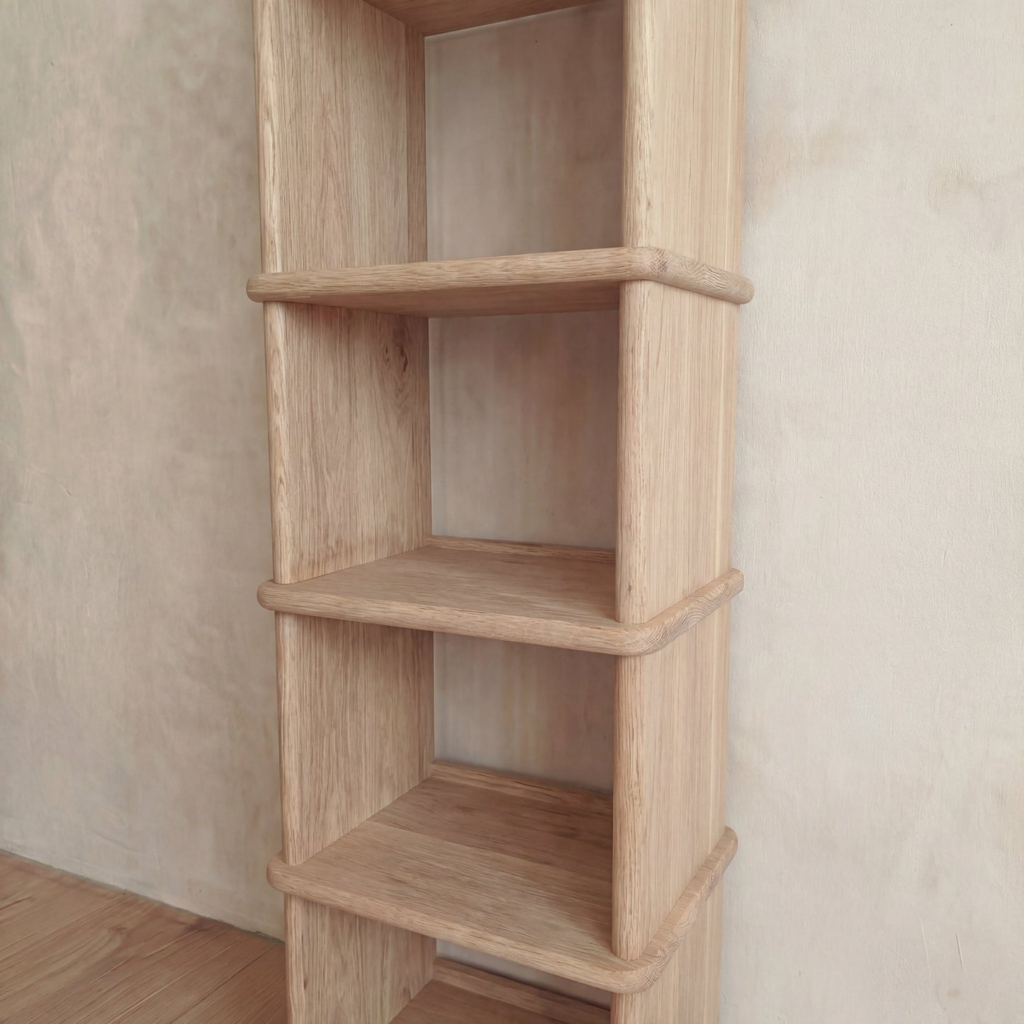 Tall narrow bookcase in white oak