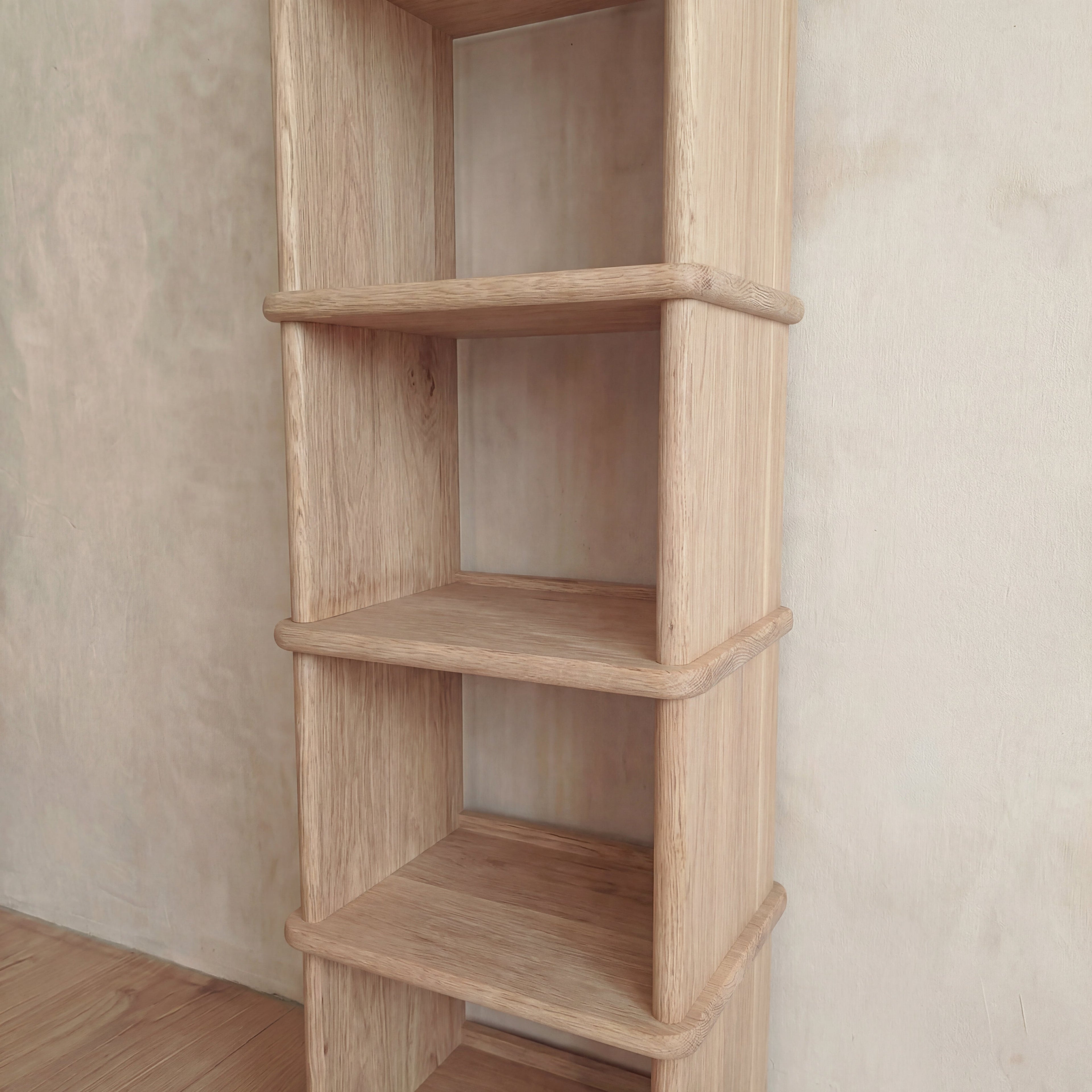 Tall narrow bookcase in white oak
