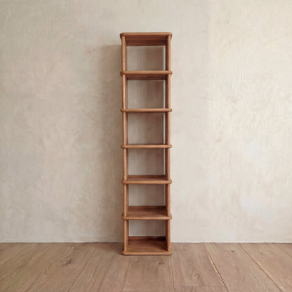 Tall narrow bookcase in red oak