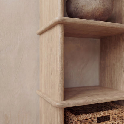 Narrow bookshelf in white oak